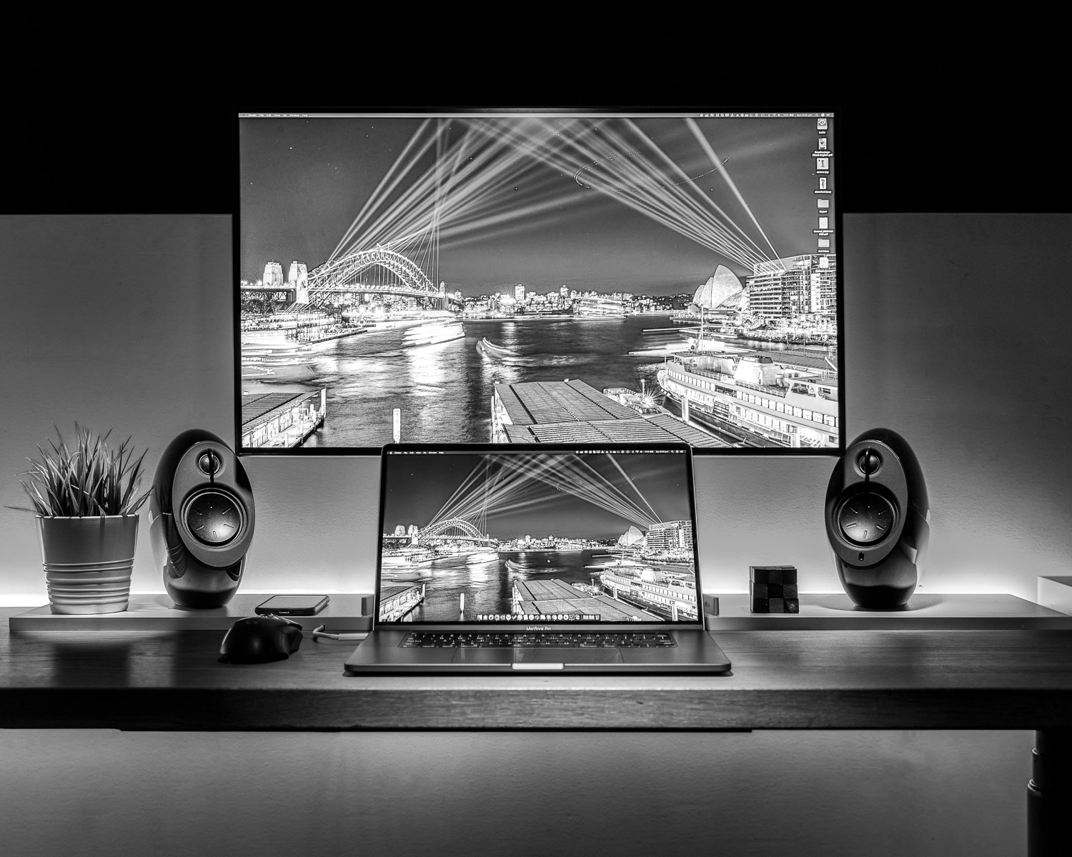 black and silver speaker on brown wooden table