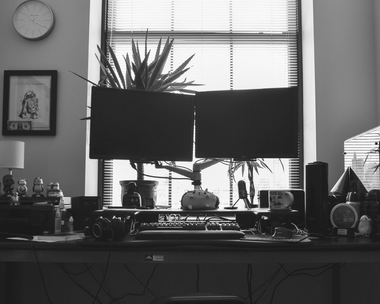 black flat screen computer monitor on brown wooden desk