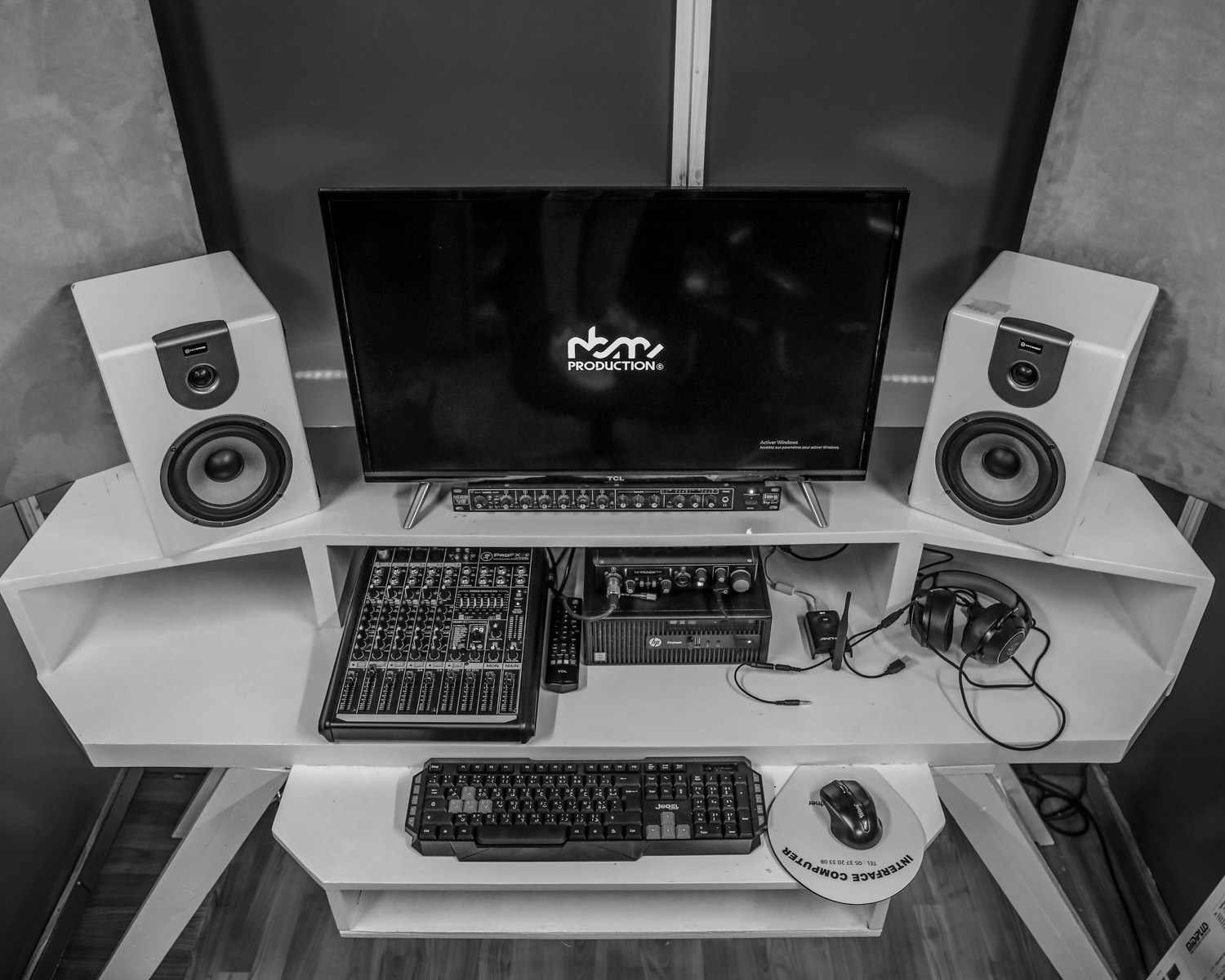 black flat screen computer monitor and black computer keyboard on white wooden desk