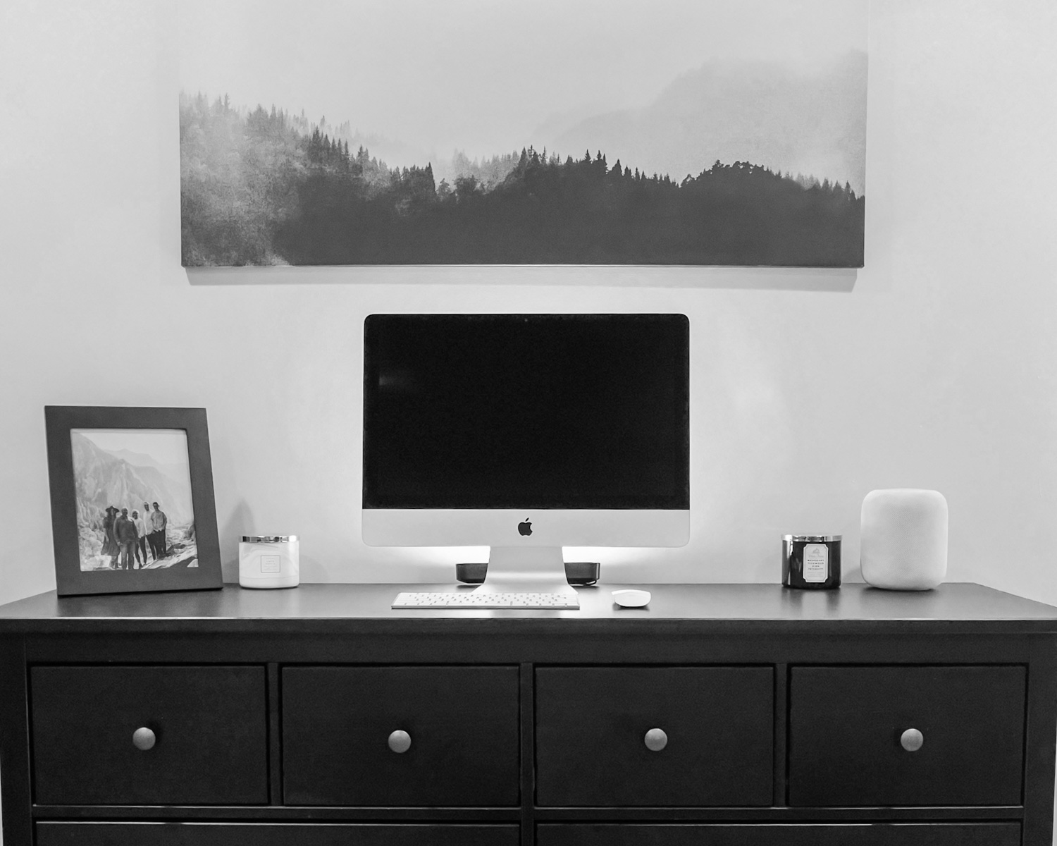 black flat screen tv on white wooden drawer