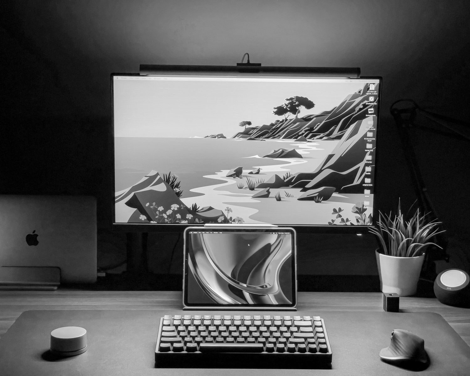 a laptop computer sitting on top of a desk