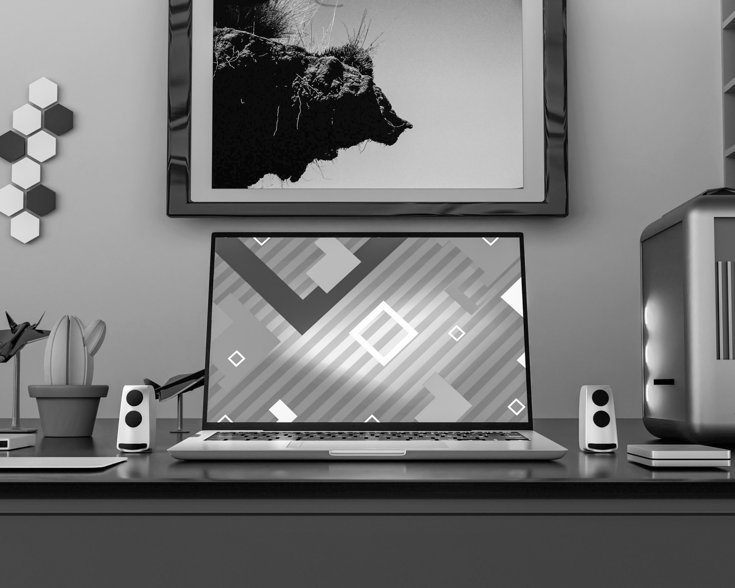 a laptop computer sitting on top of a desk