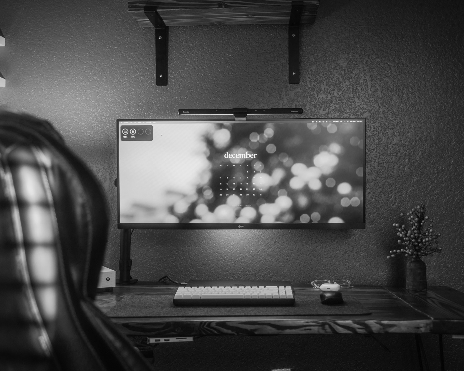 A computer desk with a monitor and keyboard