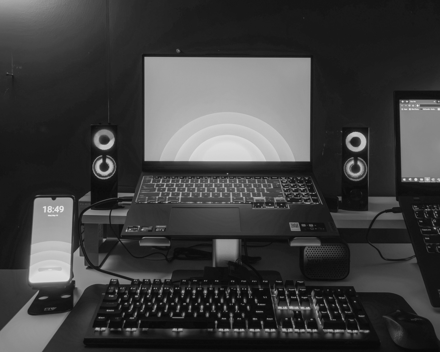a laptop computer sitting on top of a desk
