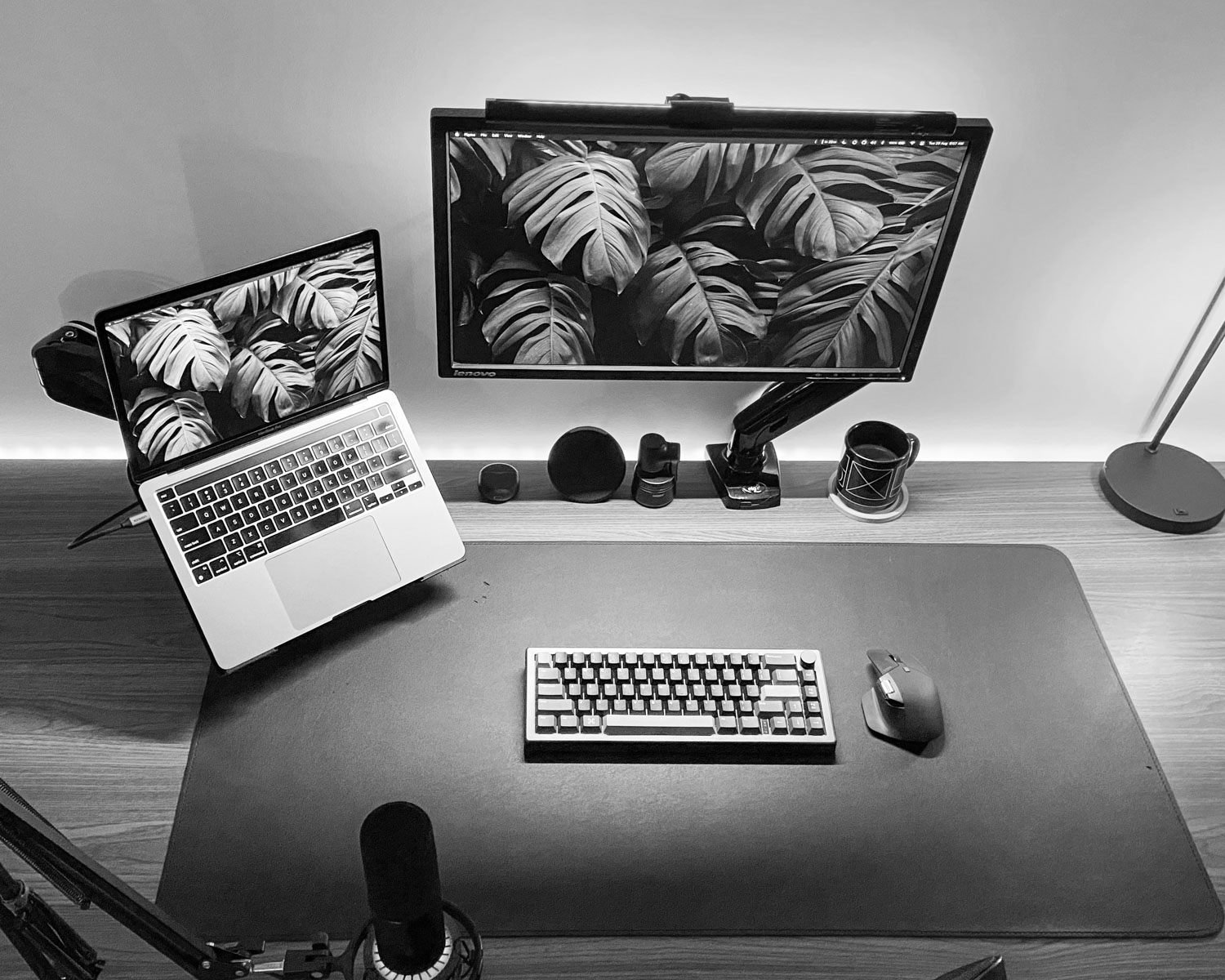 a laptop computer sitting on top of a wooden desk