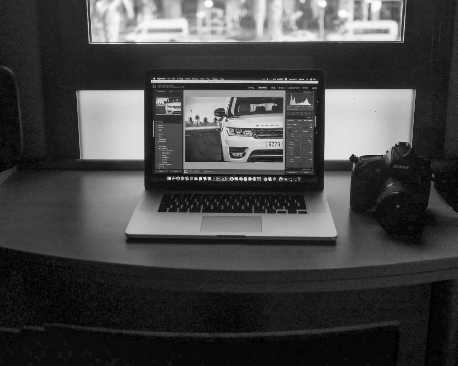 MacBook Pro displaying white vehicle