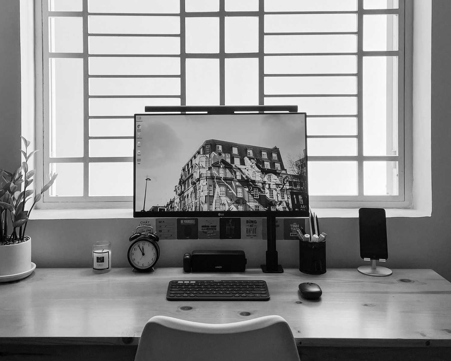 black flat screen computer monitor on brown wooden desk