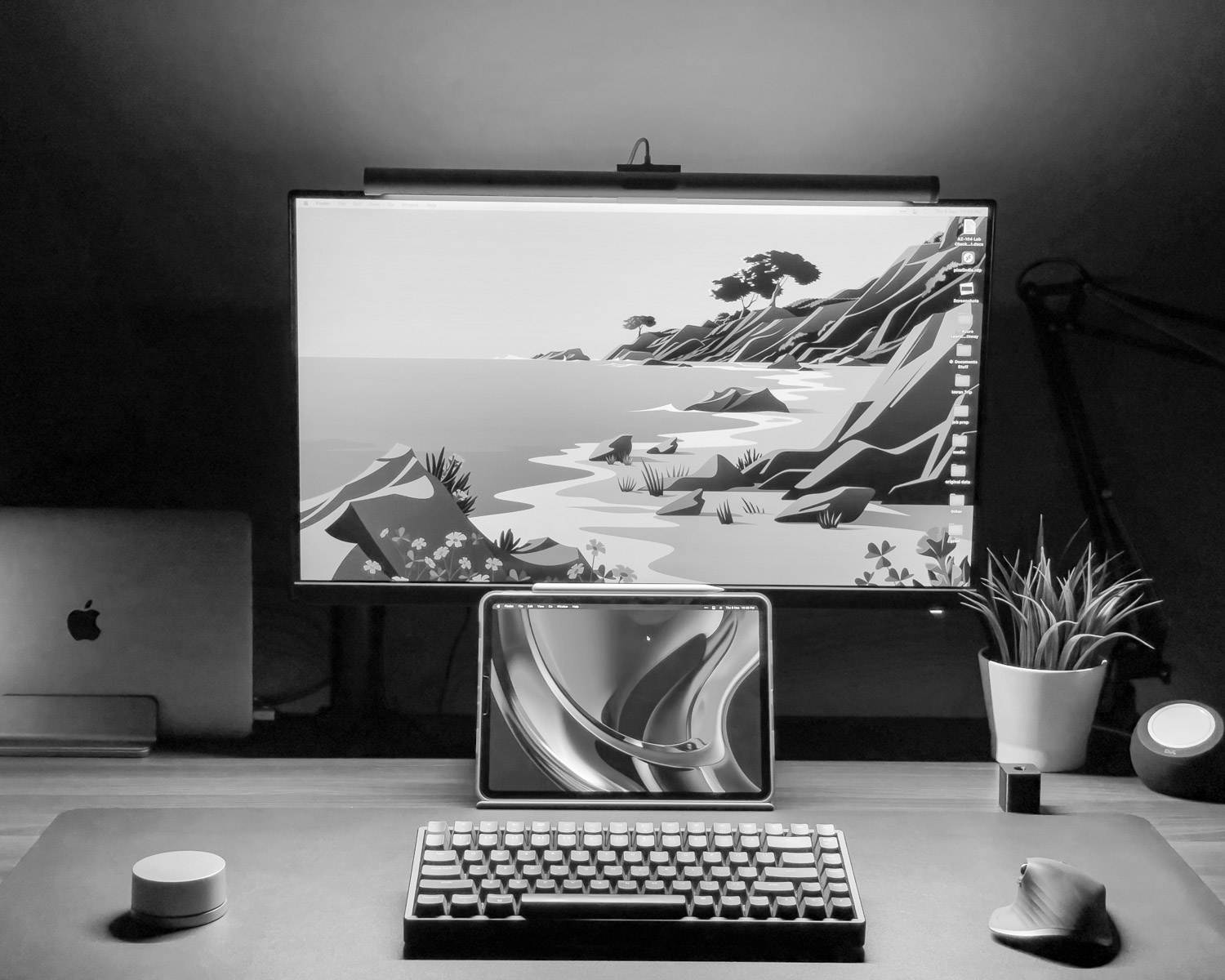 a laptop computer sitting on top of a desk