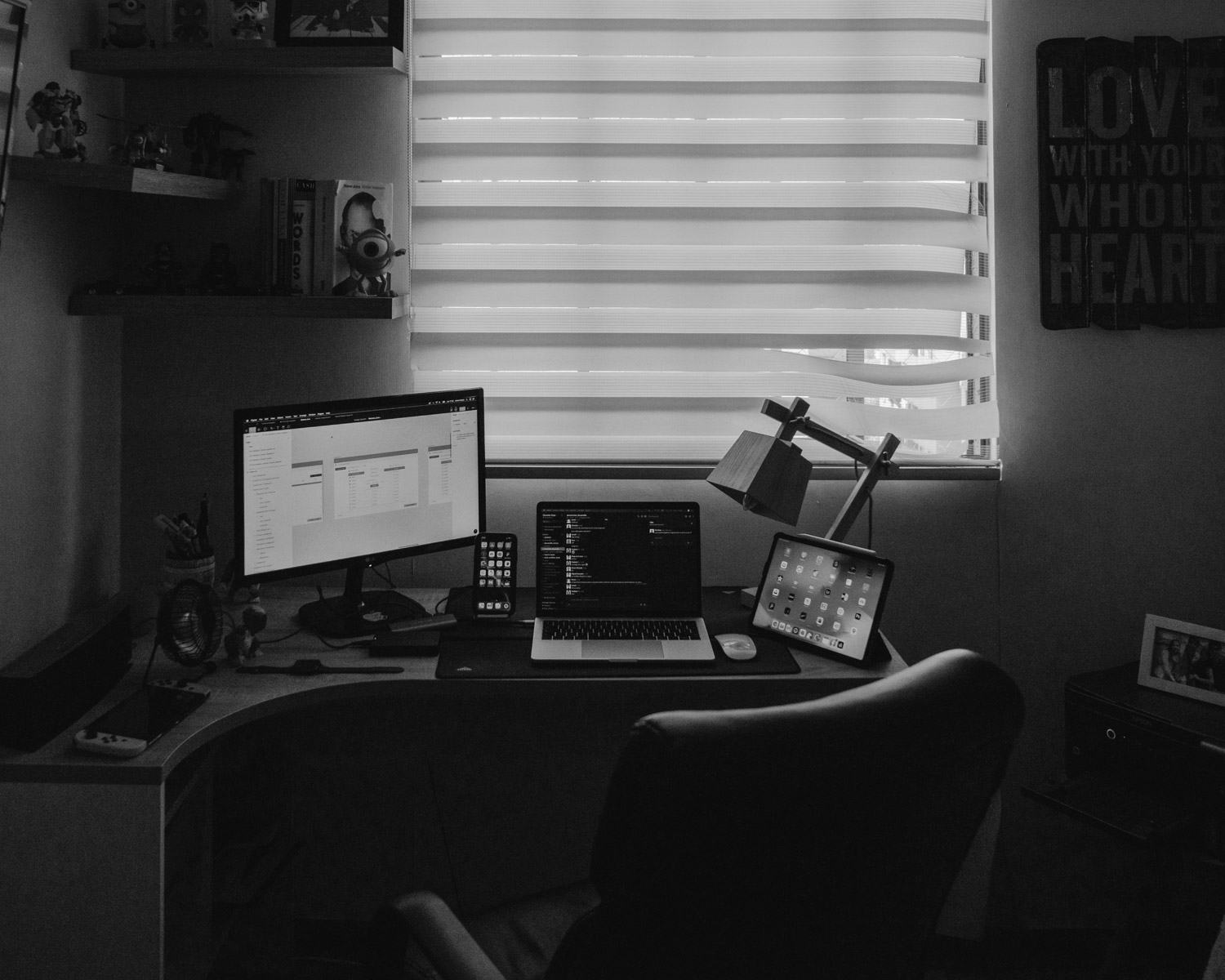black flat screen computer monitor on brown wooden desk