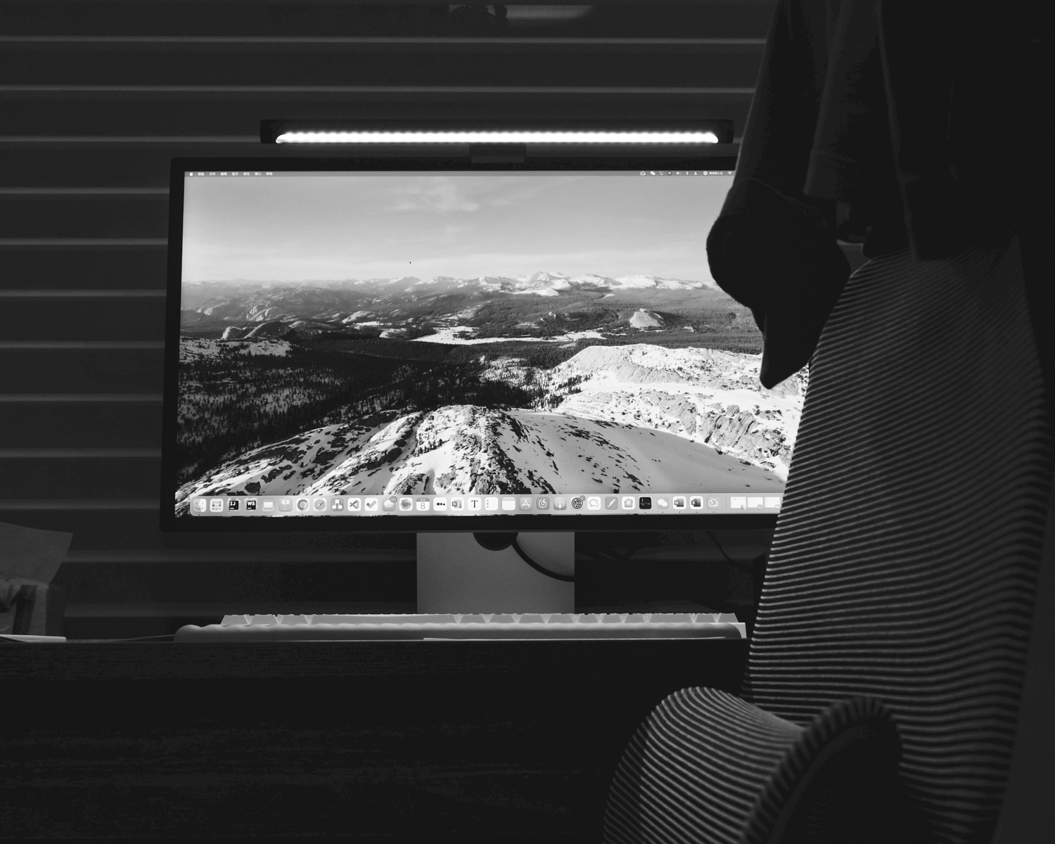 a computer monitor sitting on top of a desk