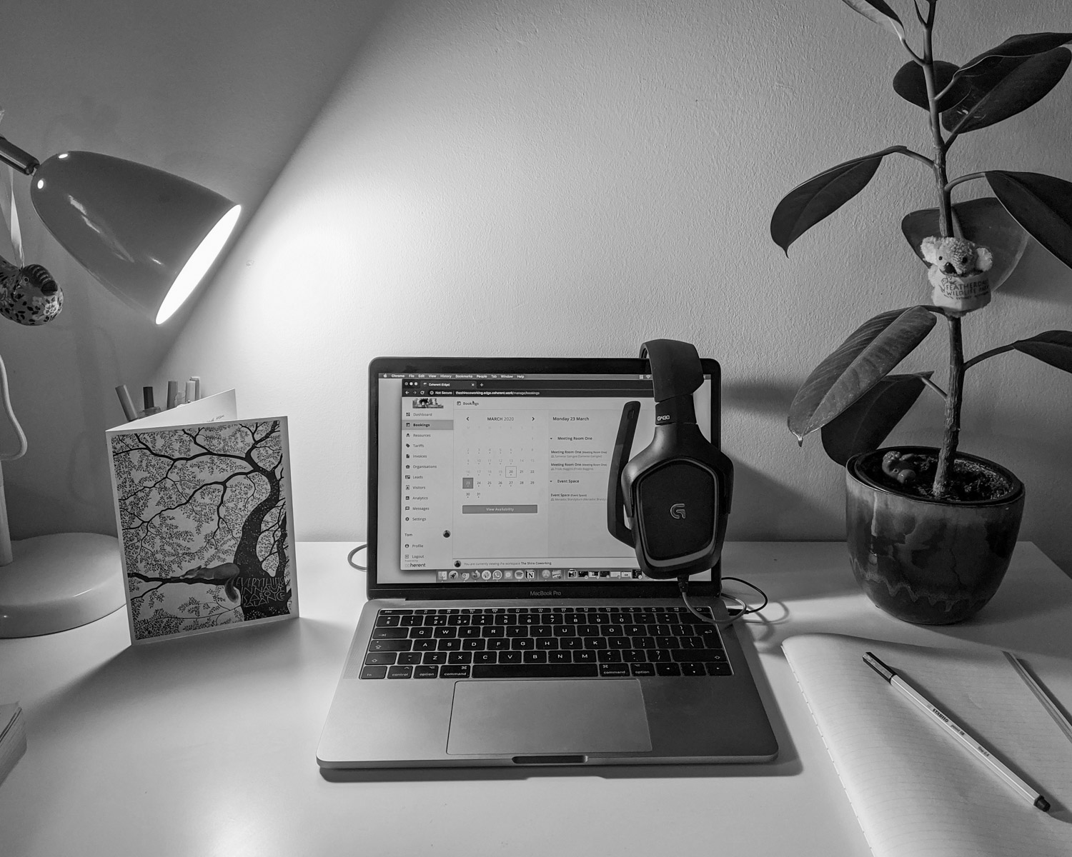 macbook pro on white table